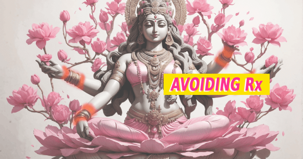A statue of an Indian goddess with four arms and red wrists, surrounded by flowers.